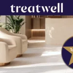 Selo Treatwell Top Rated 2026, conquistado com avaliações de clientes, na receção luminosa de um salão com cadeirões cor creme e plantas